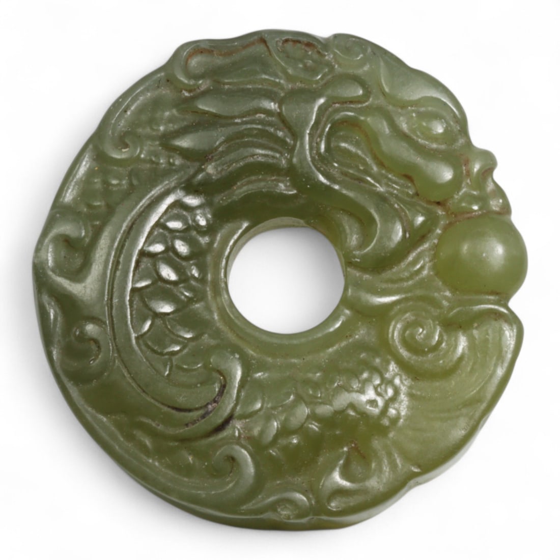 Chinese Antique Jade Bi Disc with Dragon and Pearl Motif, c. 19th-20th Century, 45g: This captivating jade bi disc features a dynamic carving of a sinuous dragon in pursuit of the flaming pearl-a powerful motif in Chinese mythology that embodies the pursuit of wisdom, spiritual enligh