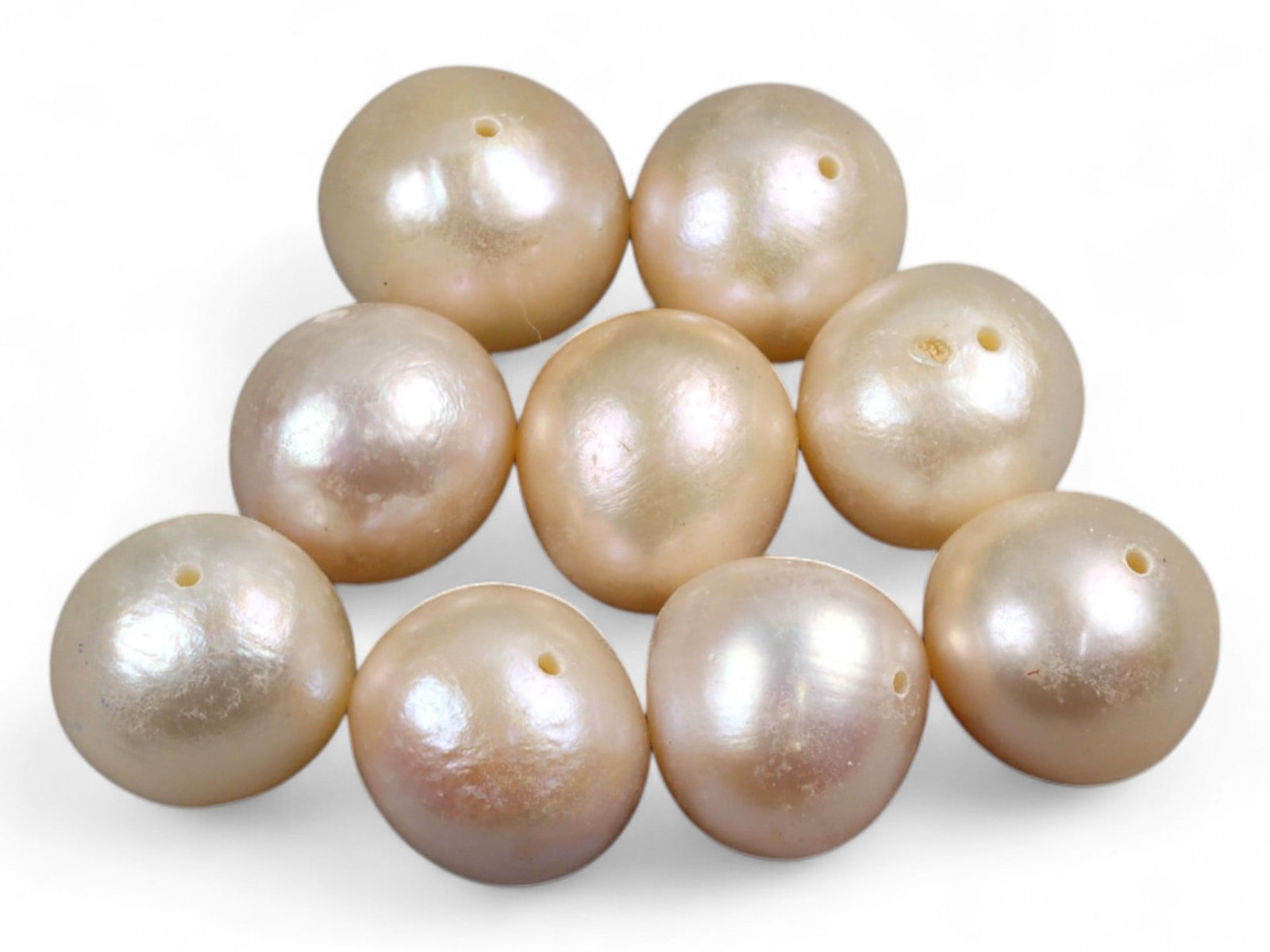 Chinese Freshwater Peach Pearl Bead Lot, 8mm 8.5g: This charming lot of Chinese freshwater pearls radiates a warm peach tone with subtle iridescent overtones of pink, gold, and cream. Each pearl measures around 8mm in diameter, their rounded baroque f