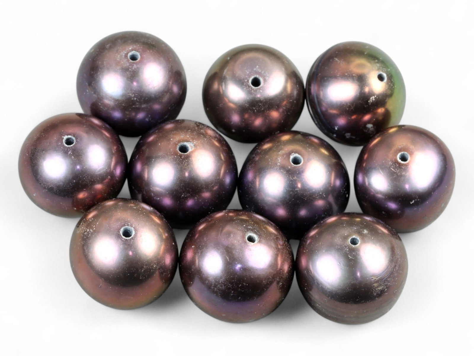 Chinese Freshwater Black Pearl Bead Lot, 9mm 9g: This refined lot of Chinese freshwater black pearls glimmers with rich iridescence, showing deep tones of violet, bronze, and midnight blue. Each pearl measures approximately 9mm in diameter, their ro