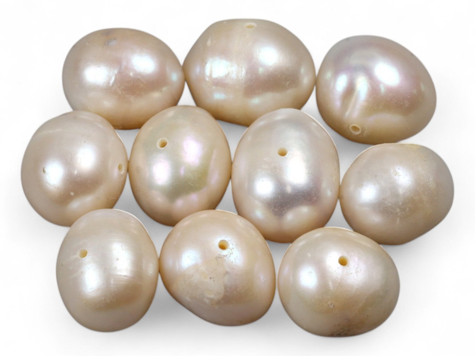 Chinese Freshwater Baroque Oval Pearl Bead Lot, 11mm 15.3g: This graceful lot of Chinese freshwater baroque oval pearls shines with soft ivory luster and delicate overtones of pink, silver, and cream. Measuring approximately 11mm, their naturally rounded-oval 