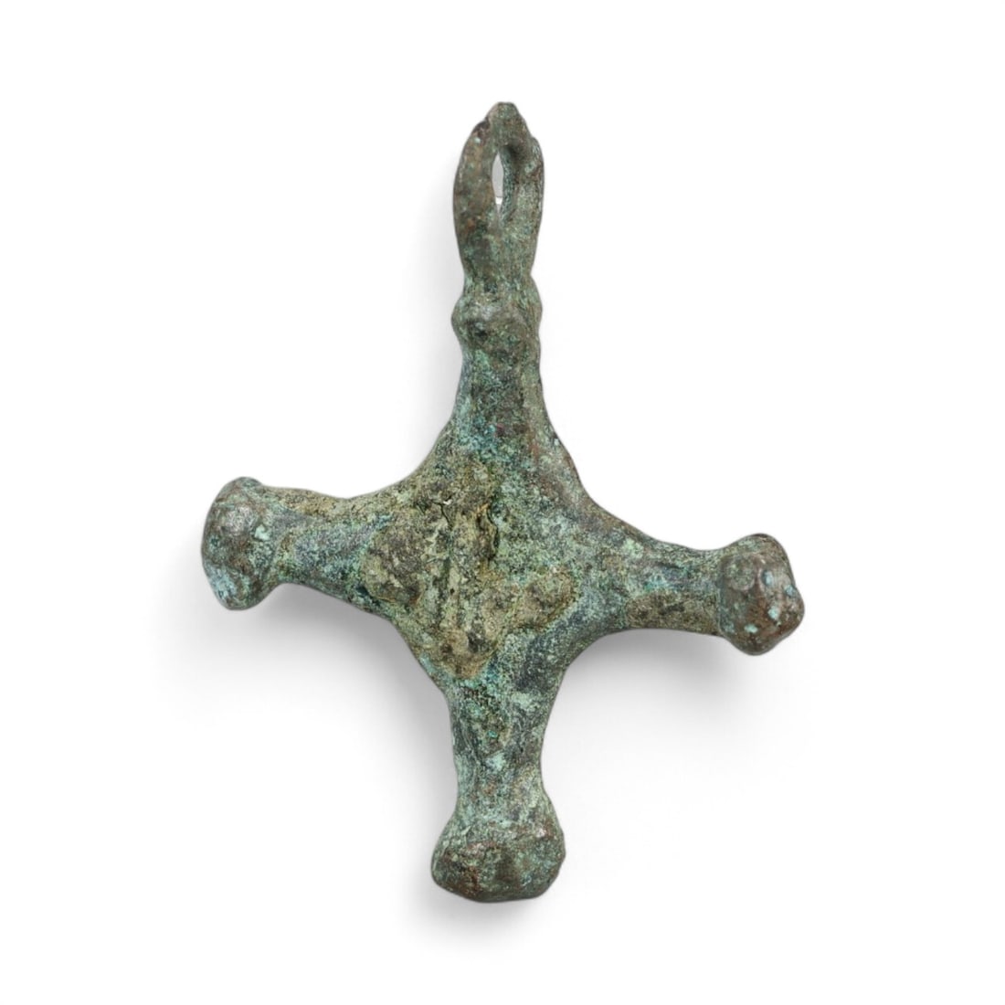 Ancient Kievan Rus Knobbed Cross Bronze Pendant, c. 10th-12th Century CE, 1g: This rare bronze cross pendant originates from the heart of medieval Eastern Europe, likely crafted during the flourishing period of the Kievan Rus between the 10th and 12th centuries CE. Found in pre
