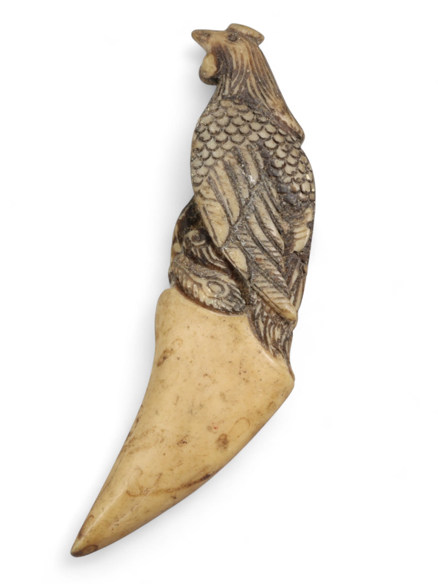 Antique Thai Bone Talisman of Rooster on Tiger Fang-Style Base, c. 20th Century CE, 24g: This intricately carved Thai talisman from the 20th century features a proud rooster perched atop a tiger fang-shaped base, all carved from a single piece of bone. The motif of the rooster is deeply s