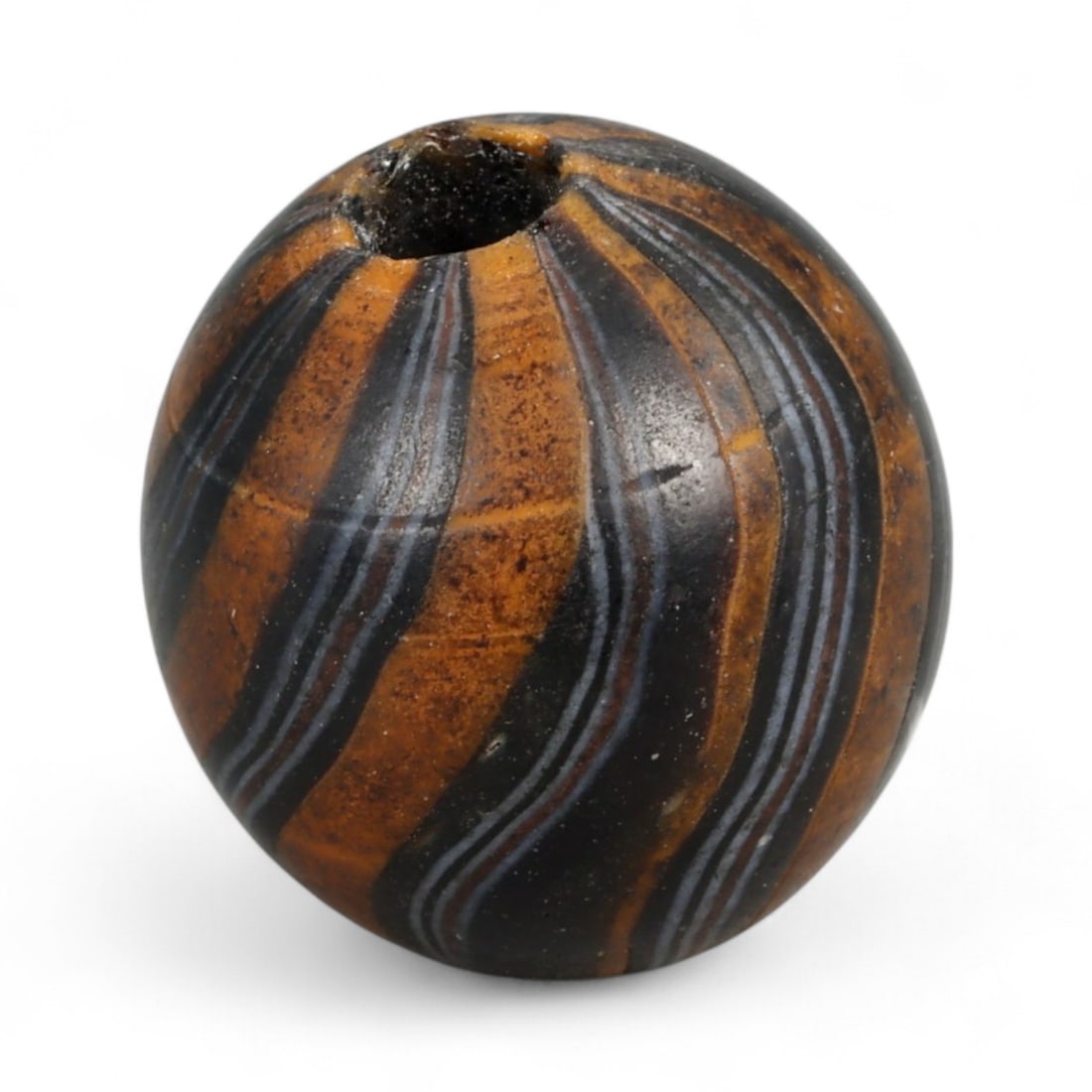 Antique Midcentury Venetian Polychrome Chevron Glass Bead, c. 20th Century 1.8cm: This richly colored bead originates from the Venetian glassmaking tradition, crafted in the mid-20th century, when Murano artisans continued the centuries-old art of creating millefiori and chevron-st