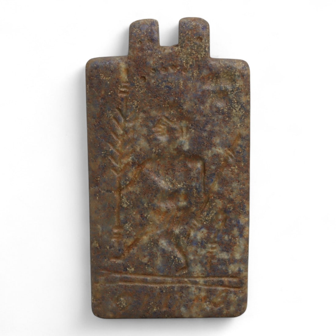 Ancient Mesopotamian Lapis Lazuli Warrior Motif Amulet Pendant, c. 2nd-1st Millennium BCE 19g: This rectangular lapis lazuli amulet pendant, measuring 5.7 cm and weighing 19 grams, originates from Mesopotamia, dating between the Late Bronze and Early Iron Age (c. 2nd-1st millennium BCE). The su