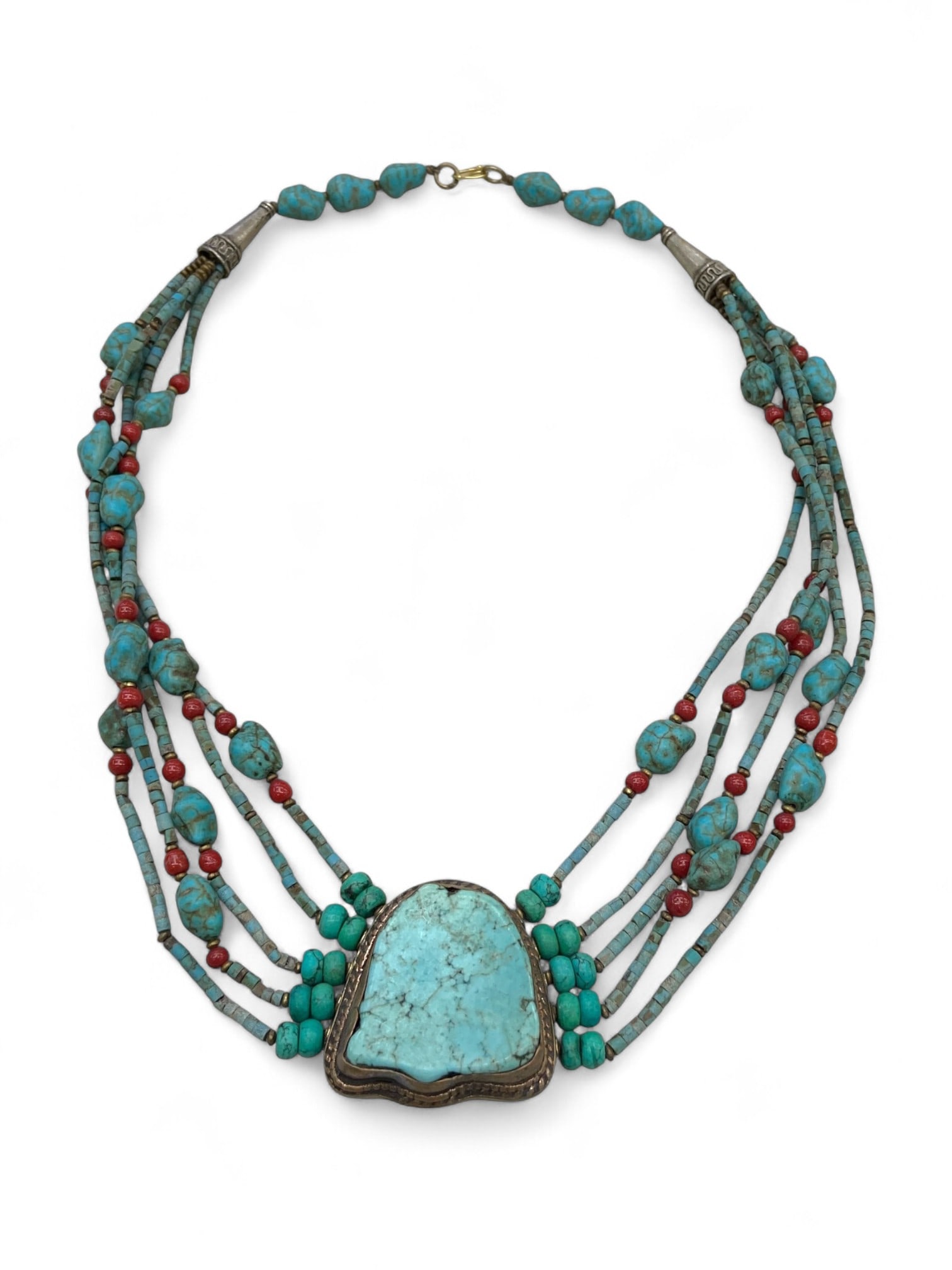 Tibetan Turquoise Nugget Pendant Necklace with Red Coral Accents, Himalayas, 107g: This powerful multi-strand necklace showcases the sacred artistry of Tibetan adornment, centered around a bold, naturally contoured turquoise pendant bezel-set in hand-crafted silver. The pendant's or
