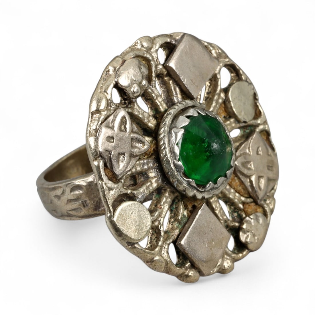 Antique Persian Ornamental Silver Ring with Green Glass Cabochon, c. 19th-20th Century 11g: This ornate antique silver ring, dating from the 19th-20th century, reflects the decorative flair of Persian craftsmanship during the late Qajar era. At its center rests a vivid green glass cabochon, 