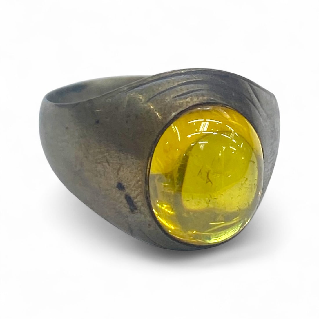 Antique Mid-20th Century Silver Ring with Golden Yellow Glass Cabochon, 7g: This sleek antique silver ring features a golden yellow glass cabochon, its translucent body catching the light with a warm, amber-like glow. The setting is minimal, with smooth shoulders subtly accen