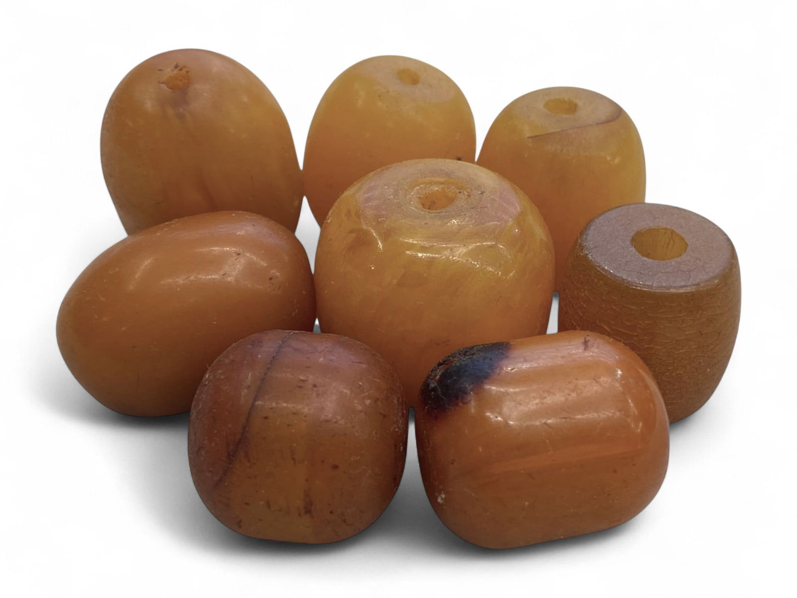 Vintage Himalayan Tibetan Amber Beads, c. Early-Mid 20th Century, 2-2.6cm, 60g: This collection of eight vintage amber beads originates from the Himalayan-Tibetan region, where amber has long been prized for its spiritual, medicinal, and ornamental qualities. Dating to the early
