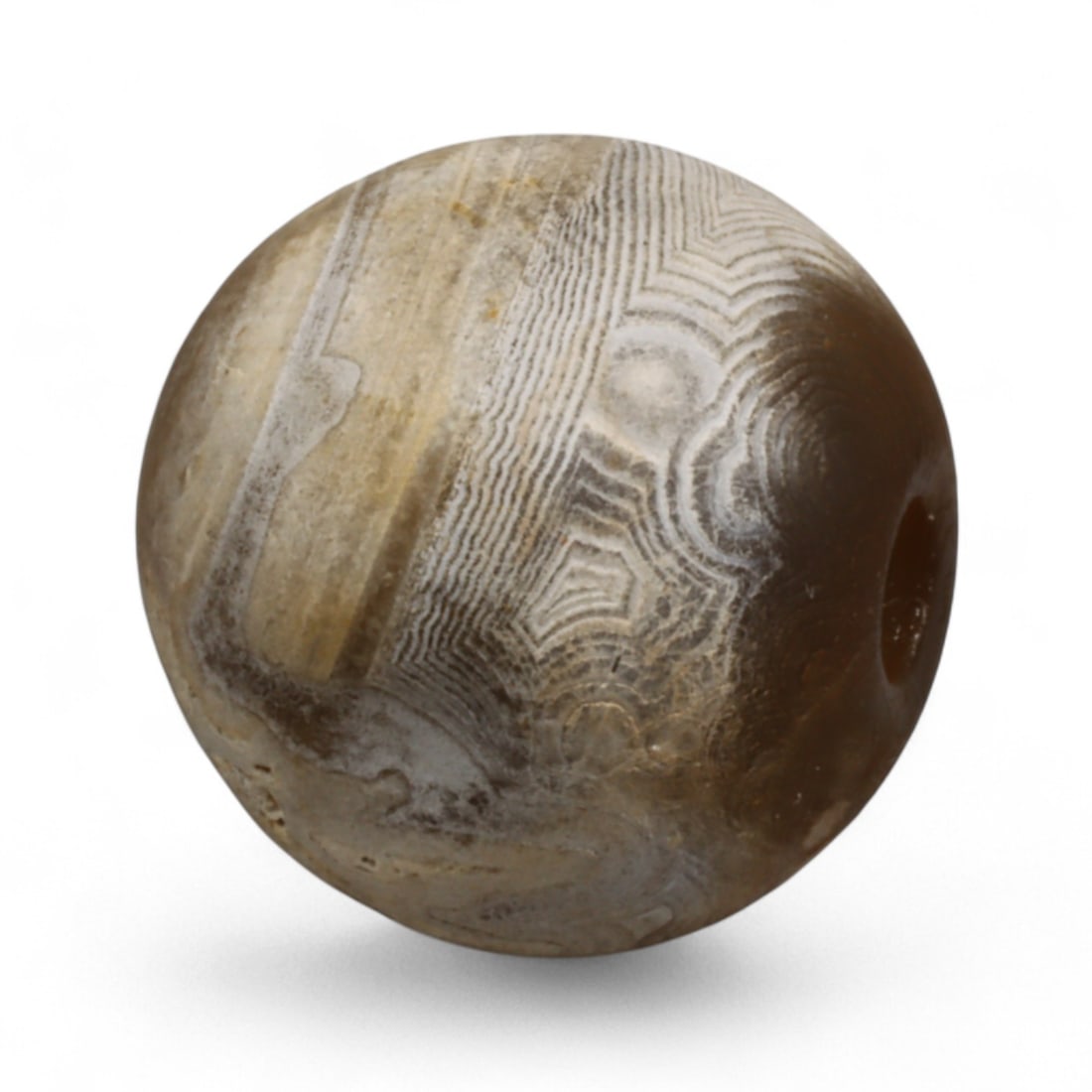Antique Tibetan Agate Mala Prayer Bead, c. 18th-19th Century, 1.5cm: This antique mala bead, measuring 1.7 cm, is carved from naturally banded agate and originates from the spiritual heartland of Tibet. Agate beads such as this were integral components of Buddhist pray