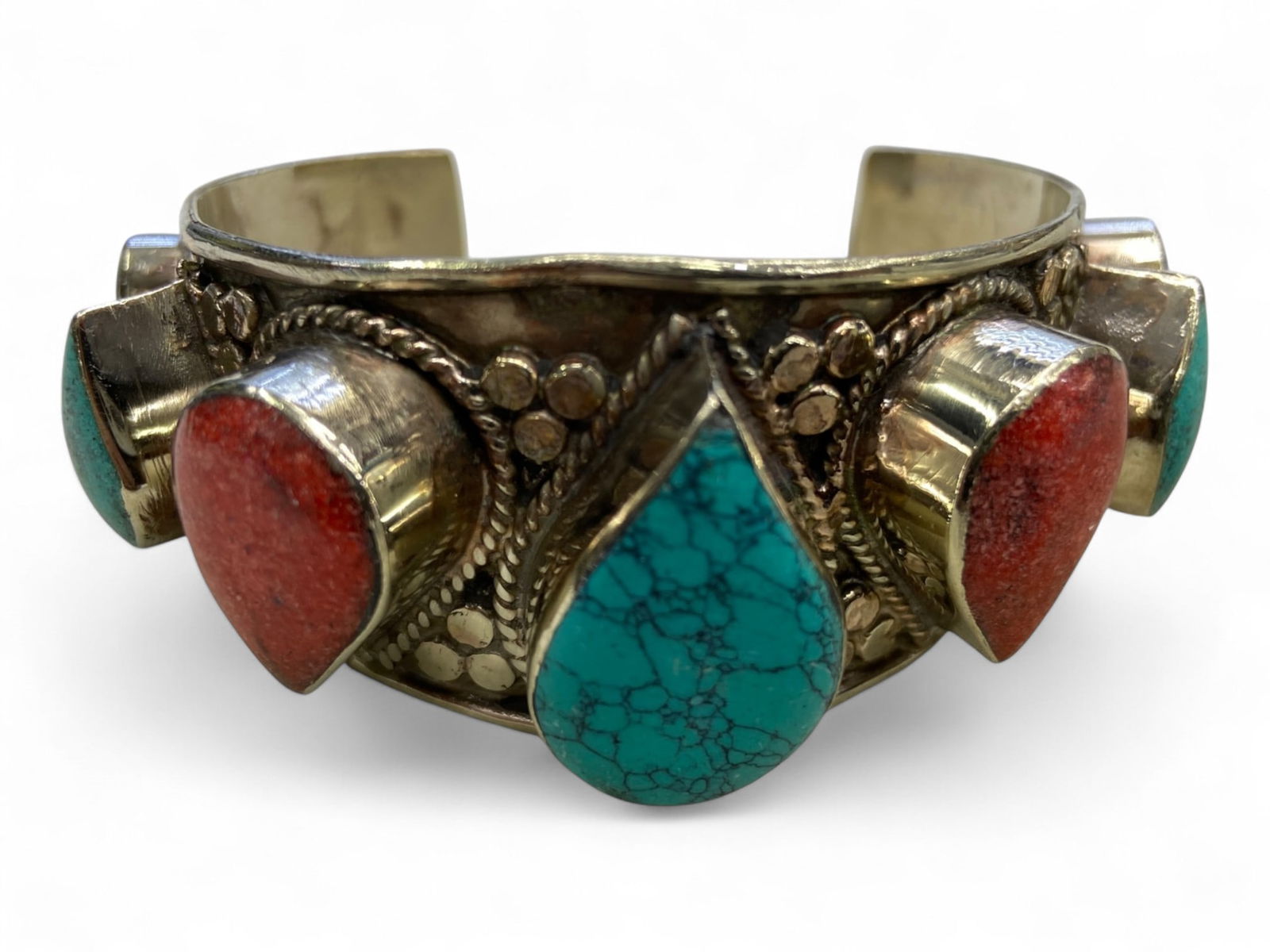 Vintage Himalayan Tibetan Tribal Bangle Bracelet, c. 20th Century, 143g: Himalayan Tibetan bangles of this type represent a distinctive form of tribal adornment, blending bold design with deep cultural symbolism. Typically crafted from mixed metals and set with prominent r