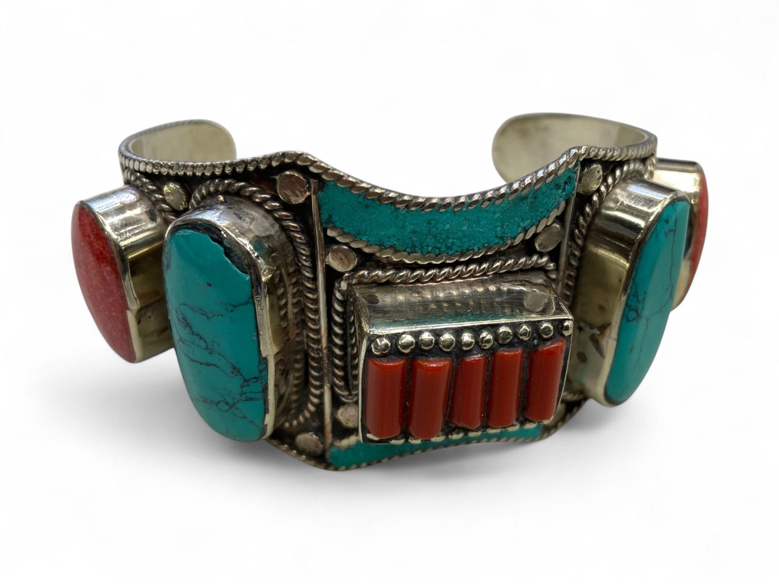 Vintage Himalayan Tibetan Tribal Bangle Bracelet, c. 20th Century, 147g: Himalayan Tibetan bangles of this type represent a distinctive form of tribal adornment, blending bold design with deep cultural symbolism. Typically crafted from mixed metals and set with prominent r