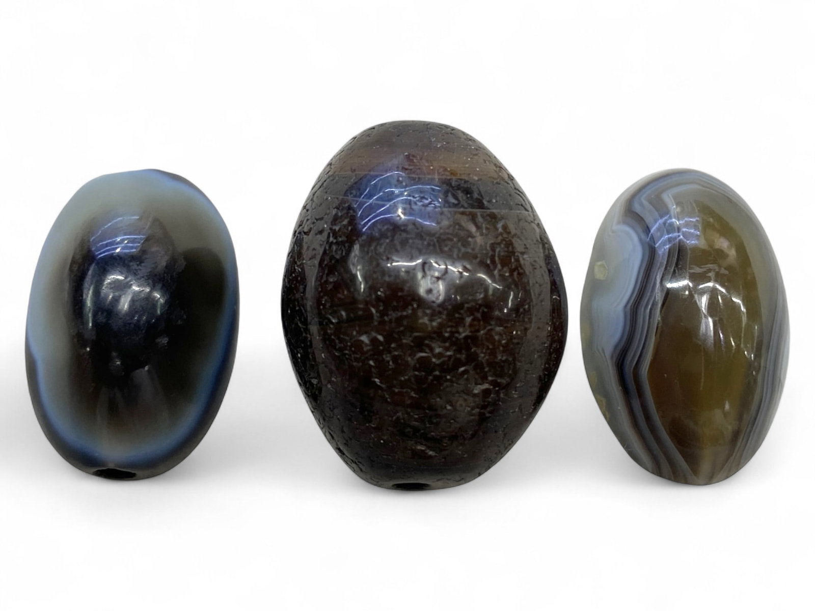 Ancient Medieval Islamic Banded Agate Bead Trio, c. 10th-13th Century CE 26g, 2.5-3cm: This elegant group of three medieval agate beads, dating from the 10th-13th century CE, reflects the rich lapidary traditions of the Islamic world during its flourishing medieval period. Carved from b