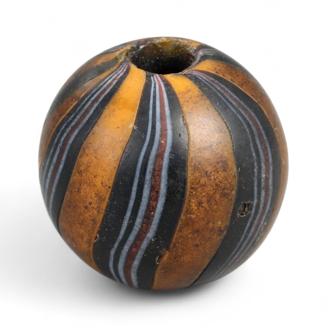 Antique Midcentury Venetian Polychrome Chevron Glass Bead, c. 20th Century 1.8cm: This richly colored bead originates from the Venetian glassmaking tradition, crafted in the mid-20th century, when Murano artisans continued the centuries-old art of creating millefiori and chevron-st