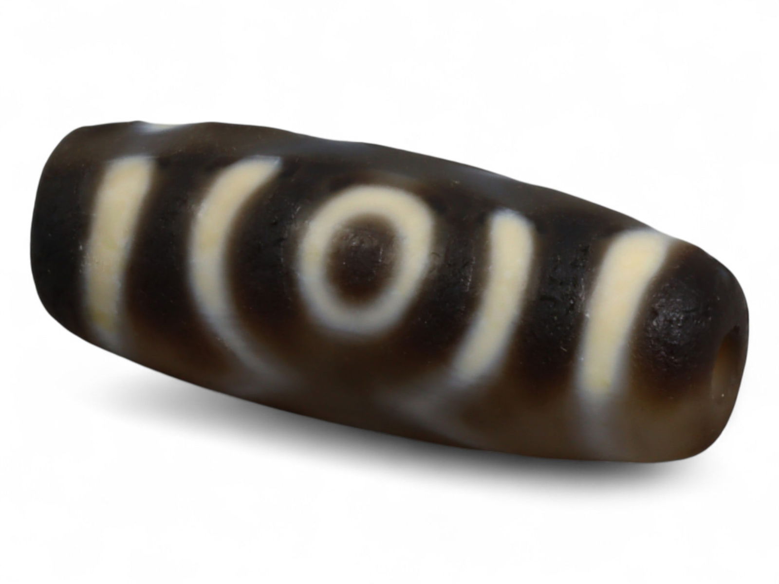 Antique Tibetan Chung Dzi Bead, 19th-20th Century, 2.8cm: Chung Dzi beads from Tibet are among the most enduring symbols of Himalayan spirituality and adornment, revered as much for their protective properties as for their striking appearance. Fashioned from