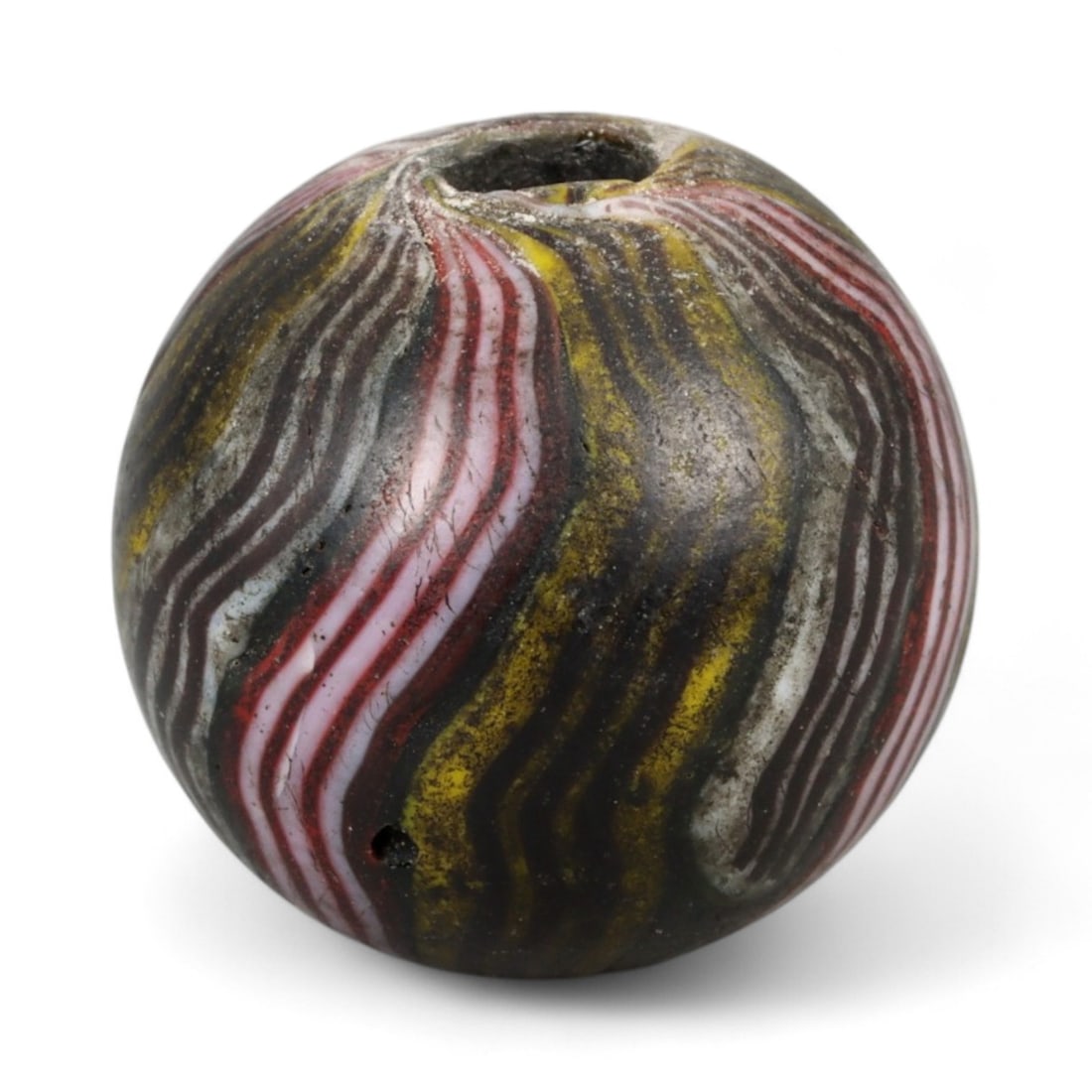 Antique Midcentury Venetian Polychrome Chevron Glass Bead, c. 20th Century 1.8cm: This richly colored bead originates from the Venetian glassmaking tradition, crafted in the mid-20th century, when Murano artisans continued the centuries-old art of creating millefiori and chevron-st