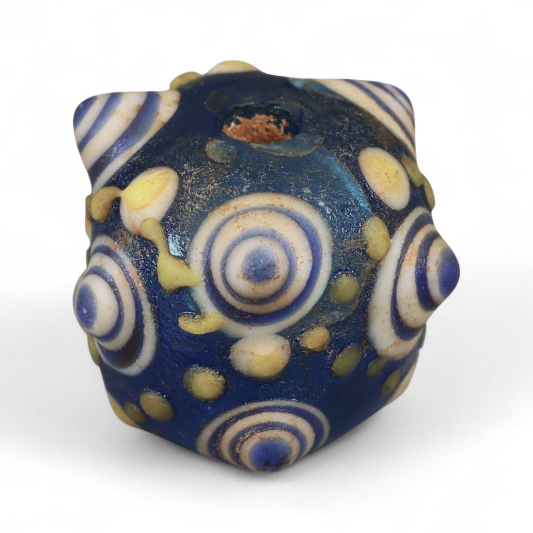 Ancient Western Asiatic Eye Mosaic Glass Bead, c. 4th-2nd Century BCE, 1.7cm: This finely crafted mosaic glass bead, originates from Western Asia and dates to the 4th-2nd century BCE. Beads of this type, often referred to as "eye beads," were highly valued across the ancient Me