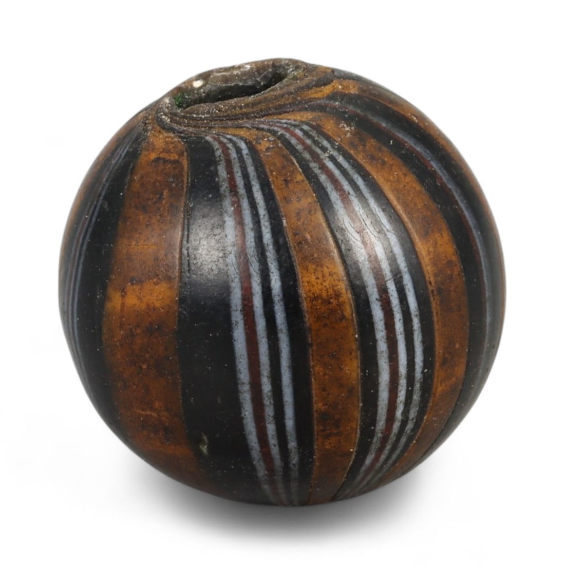 Antique Midcentury Venetian Polychrome Chevron Glass Bead, c. 20th Century 1.8cm: This richly colored bead originates from the Venetian glassmaking tradition, crafted in the mid-20th century, when Murano artisans continued the centuries-old art of creating millefiori and chevron-st