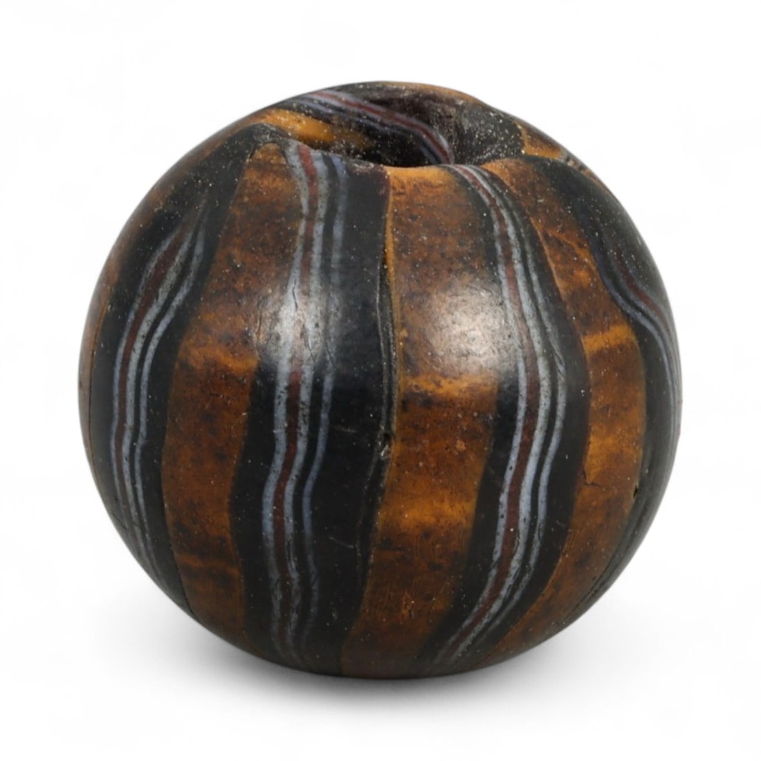 Antique Midcentury Venetian Polychrome Chevron Glass Bead, c. 20th Century 1.8cm: This richly colored bead originates from the Venetian glassmaking tradition, crafted in the mid-20th century, when Murano artisans continued the centuries-old art of creating millefiori and chevron-st