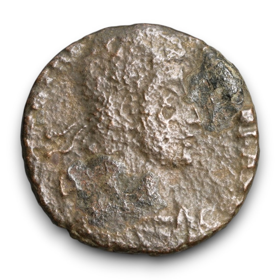 ROMAN EMPIRE: Imperial Authority - Bronze Coin, c. 1st-3rd Century AD, 19mm: Struck during the turbulent decades of the later Roman Empire, this 19mm bronze coin reflects the enduring symbolism of imperial control amidst crisis. Its compact yet deliberate design likely feature