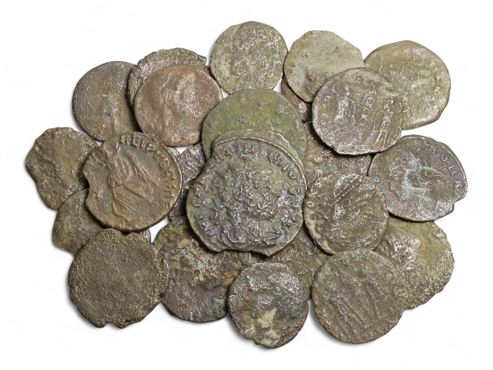 Ancient Roman Bronze Coins Lot, AE3 and AE4, c. 3rd-5th Century CE, 25 Coins: This lot of 25 bronze coins represents the currency of the late Roman Empire, spanning the 3rd to 5th centuries CE. These pieces, known as AE3 and AE4 denominations, were the small change of the Roman