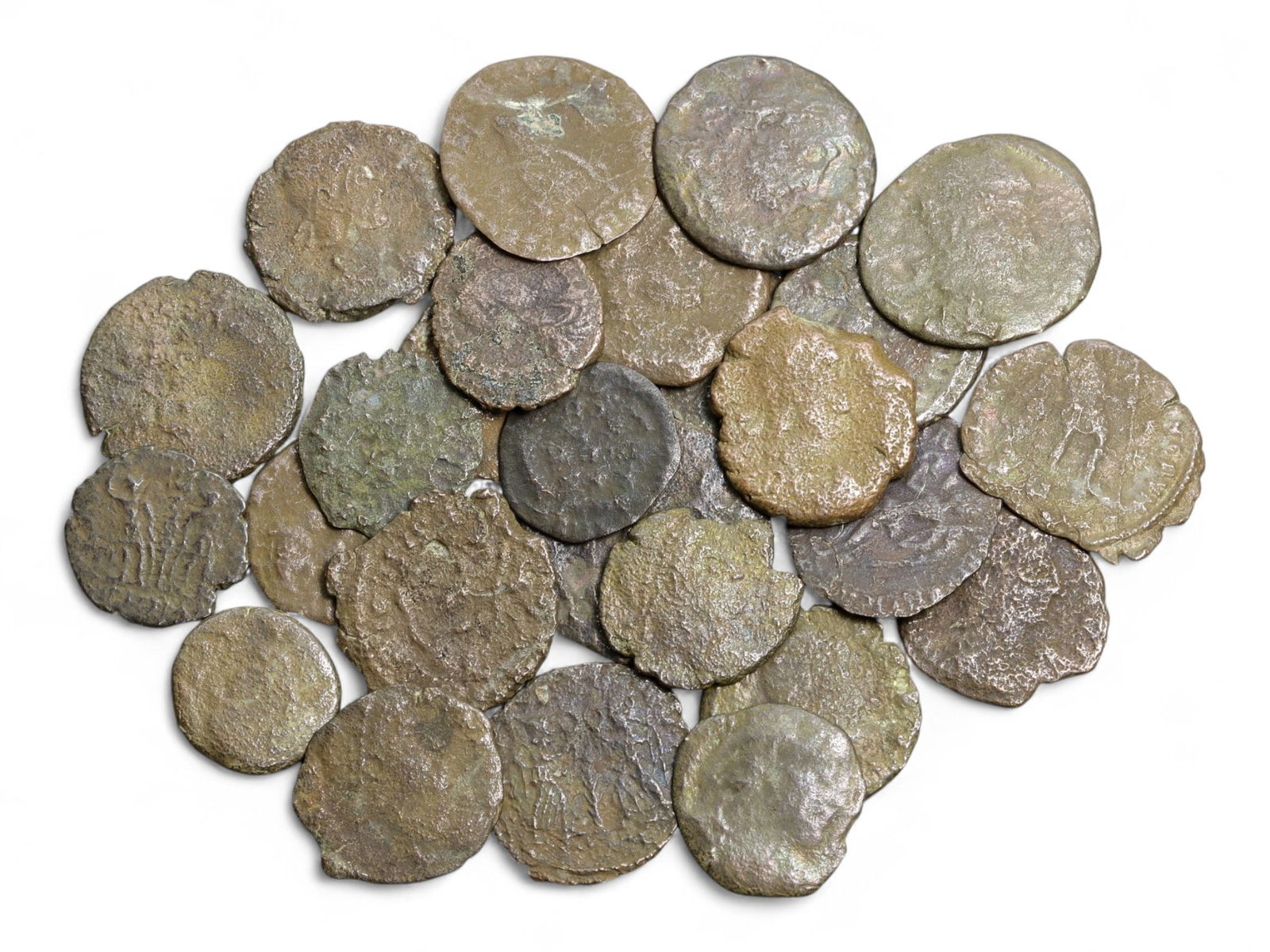 Ancient Roman Bronze Coins Lot, AE3 and AE4, c. 3rd-5th Century CE, 25 Coins: This lot of 25 bronze coins represents the currency of the late Roman Empire, spanning the 3rd to 5th centuries CE. These pieces, known as AE3 and AE4 denominations, were the small change of the Roman
