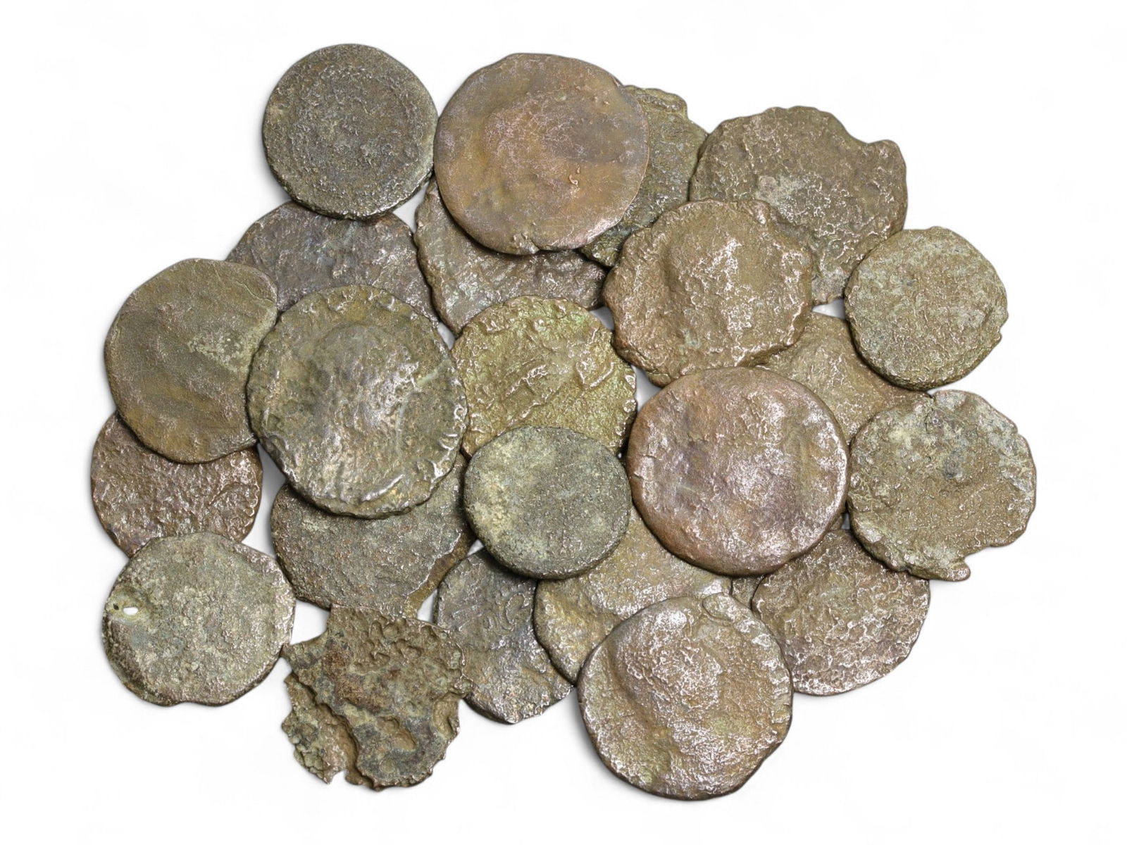 Ancient Roman Bronze Coins Lot, AE3 and AE4, c. 3rd-5th Century CE, 25 Coins: This lot of 25 bronze coins represents the currency of the late Roman Empire, spanning the 3rd to 5th centuries CE. These pieces, known as AE3 and AE4 denominations, were the small change of the Roman
