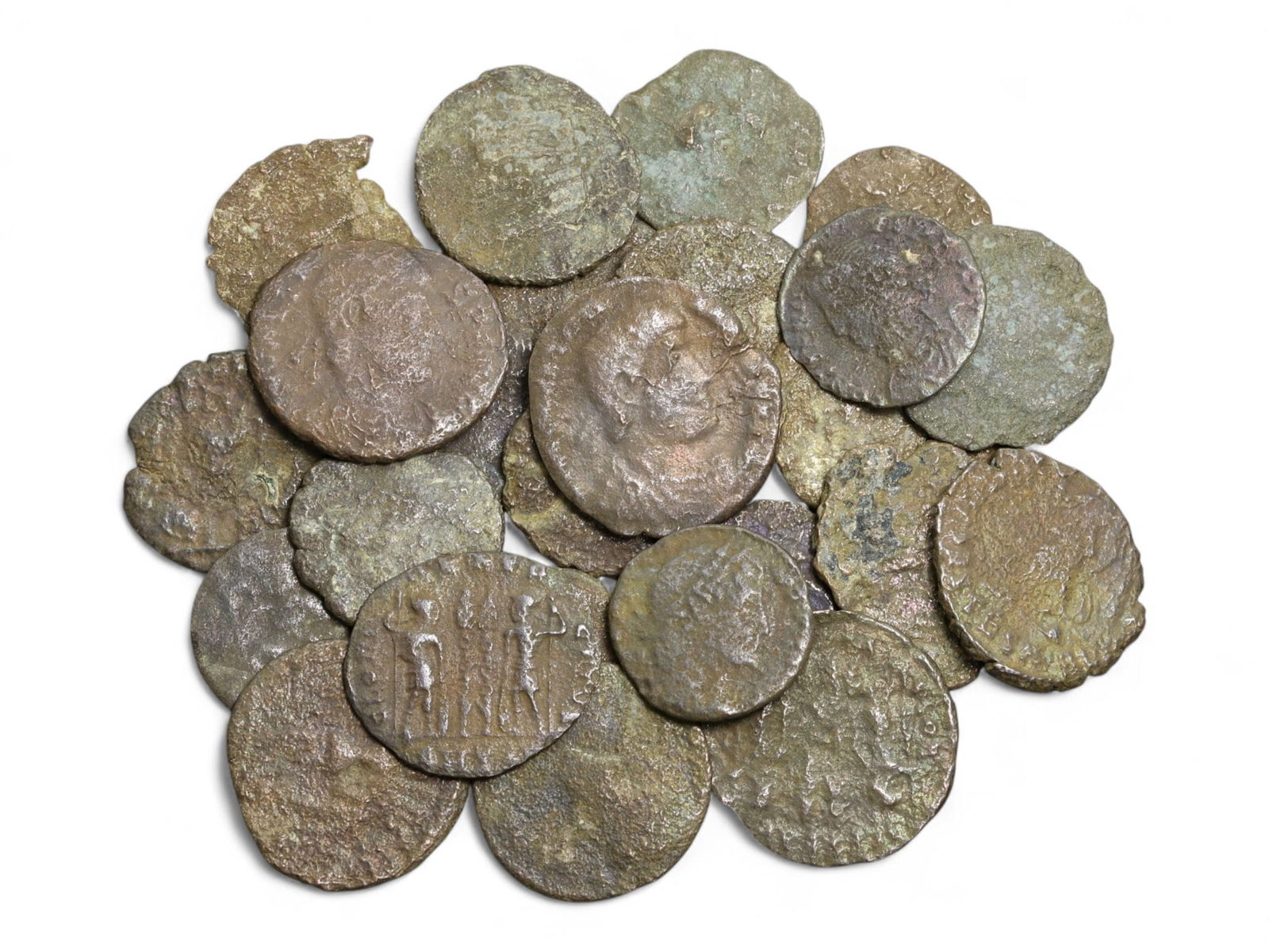 Ancient Roman Bronze Coins Lot, AE3 and AE4, c. 3rd-5th Century CE, 25 Coins: This lot of 25 bronze coins represents the currency of the late Roman Empire, spanning the 3rd to 5th centuries CE. These pieces, known as AE3 and AE4 denominations, were the small change of the Roman