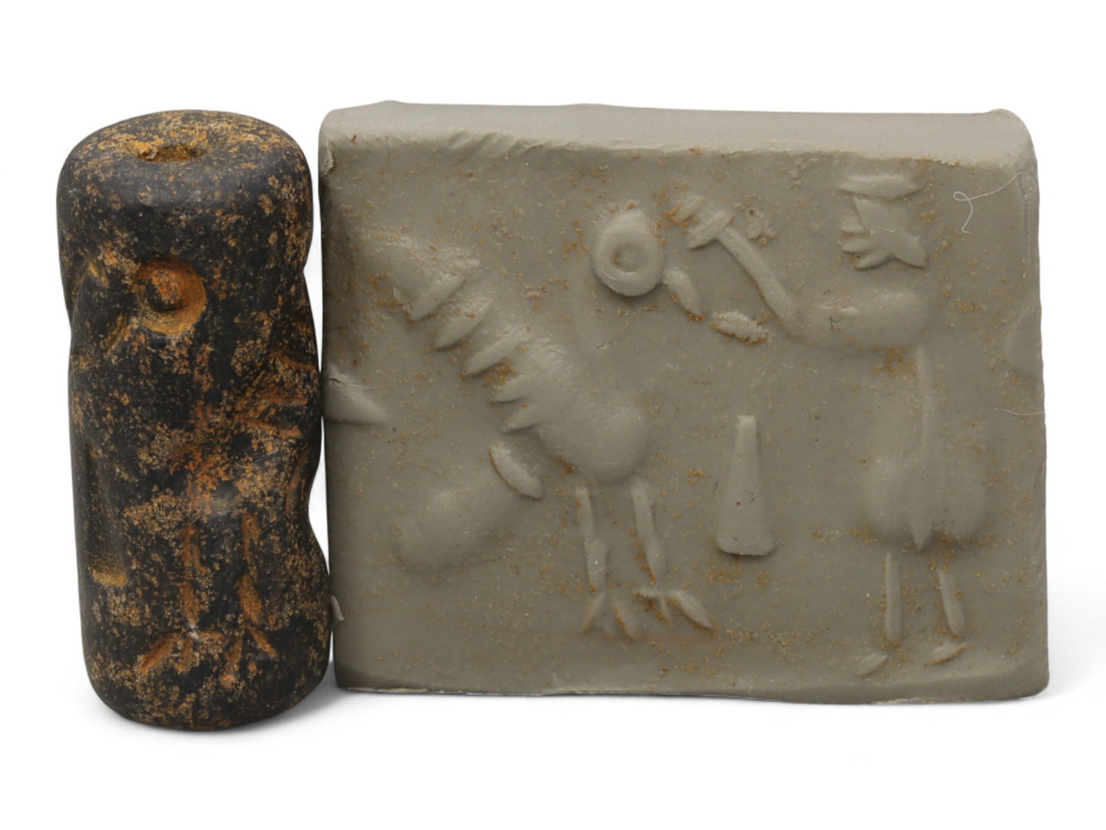 Ancient Mesopotamian Administrative Cylinder Seal, c. 2nd-1st Millennium BCE, 2.5cm: This authentic cylinder seal from ancient Mesopotamia dates to the 2nd to 1st millennium BCE, a time when the art of carving miniature narratives on stone reached remarkable levels of refinement. Seal
