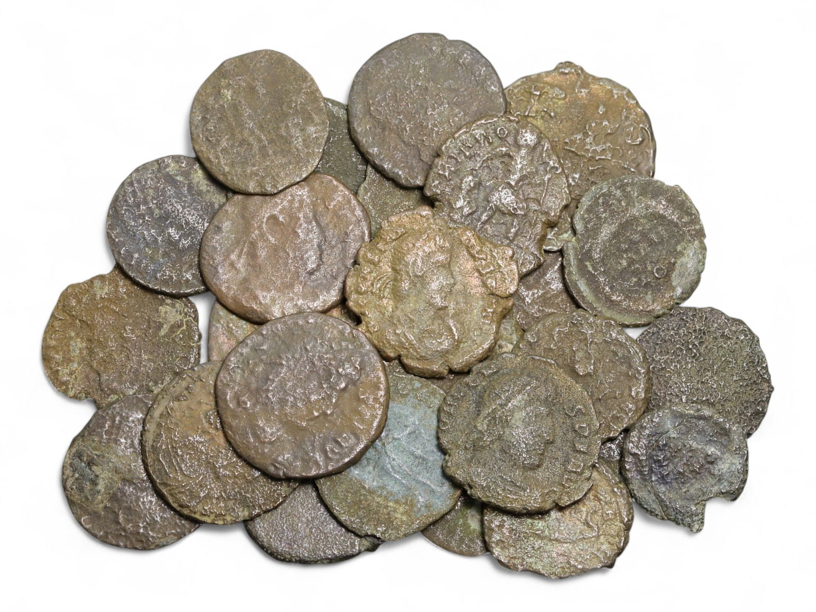 Ancient Roman Bronze Coins Lot, AE3 and AE4, c. 3rd-5th Century CE, 25 Coins: This lot of 25 bronze coins represents the currency of the late Roman Empire, spanning the 3rd to 5th centuries CE. These pieces, known as AE3 and AE4 denominations, were the small change of the Roman