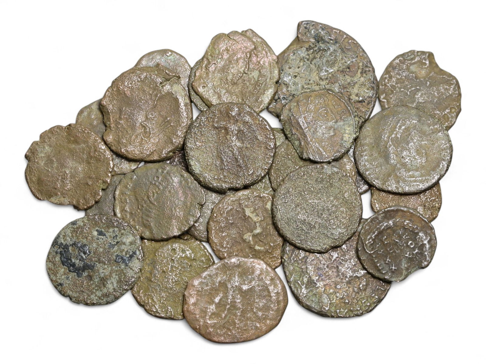 Ancient Roman Bronze Coins Lot, AE3 and AE4, c. 3rd-5th Century CE, 25 Coins: This lot of 25 bronze coins represents the currency of the late Roman Empire, spanning the 3rd to 5th centuries CE. These pieces, known as AE3 and AE4 denominations, were the small change of the Roman