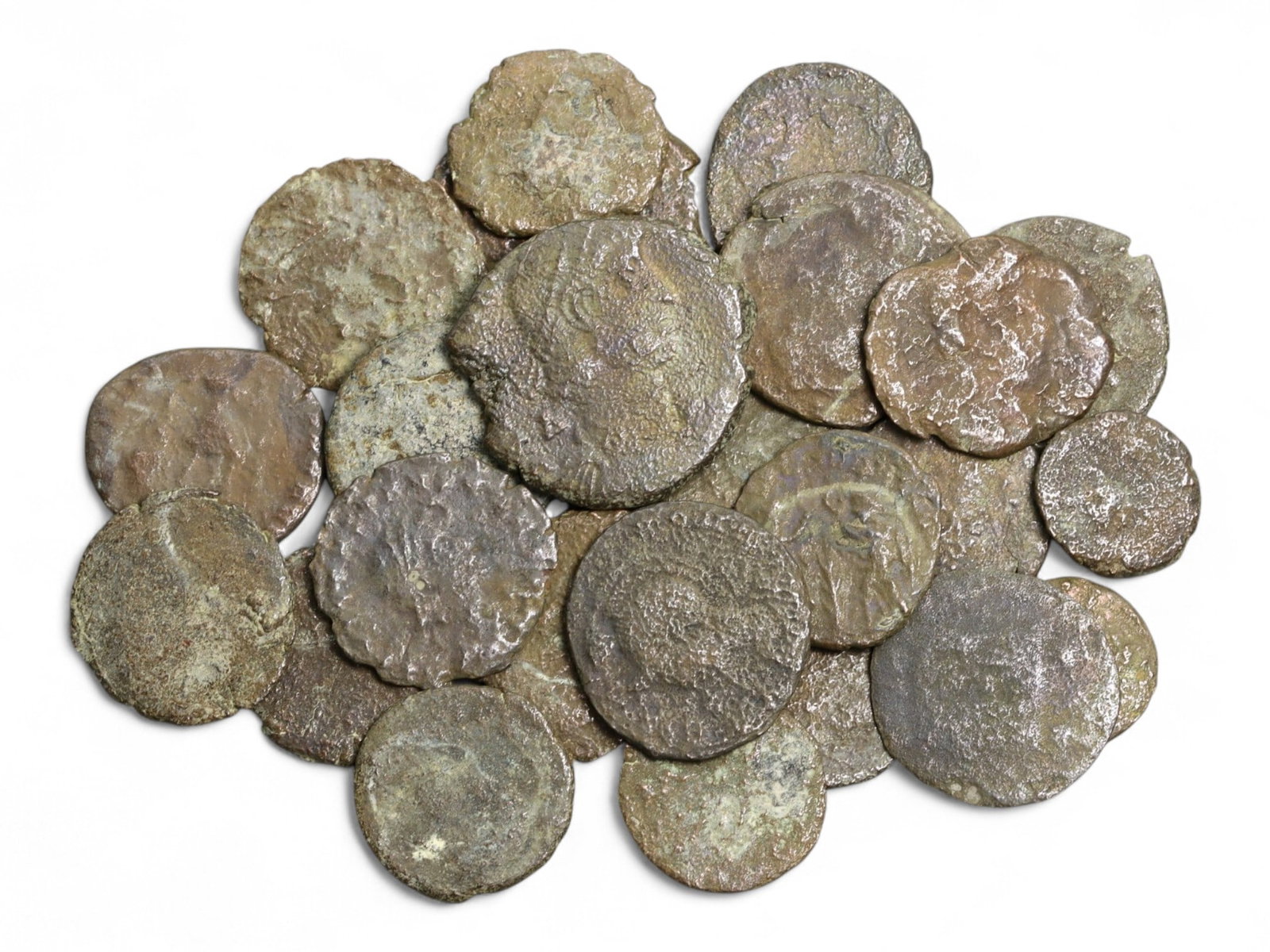 Ancient Roman Bronze Coins Lot, AE3 and AE4, c. 3rd-5th Century CE, 25 Coins: This lot of 25 bronze coins represents the currency of the late Roman Empire, spanning the 3rd to 5th centuries CE. These pieces, known as AE3 and AE4 denominations, were the small change of the Roman