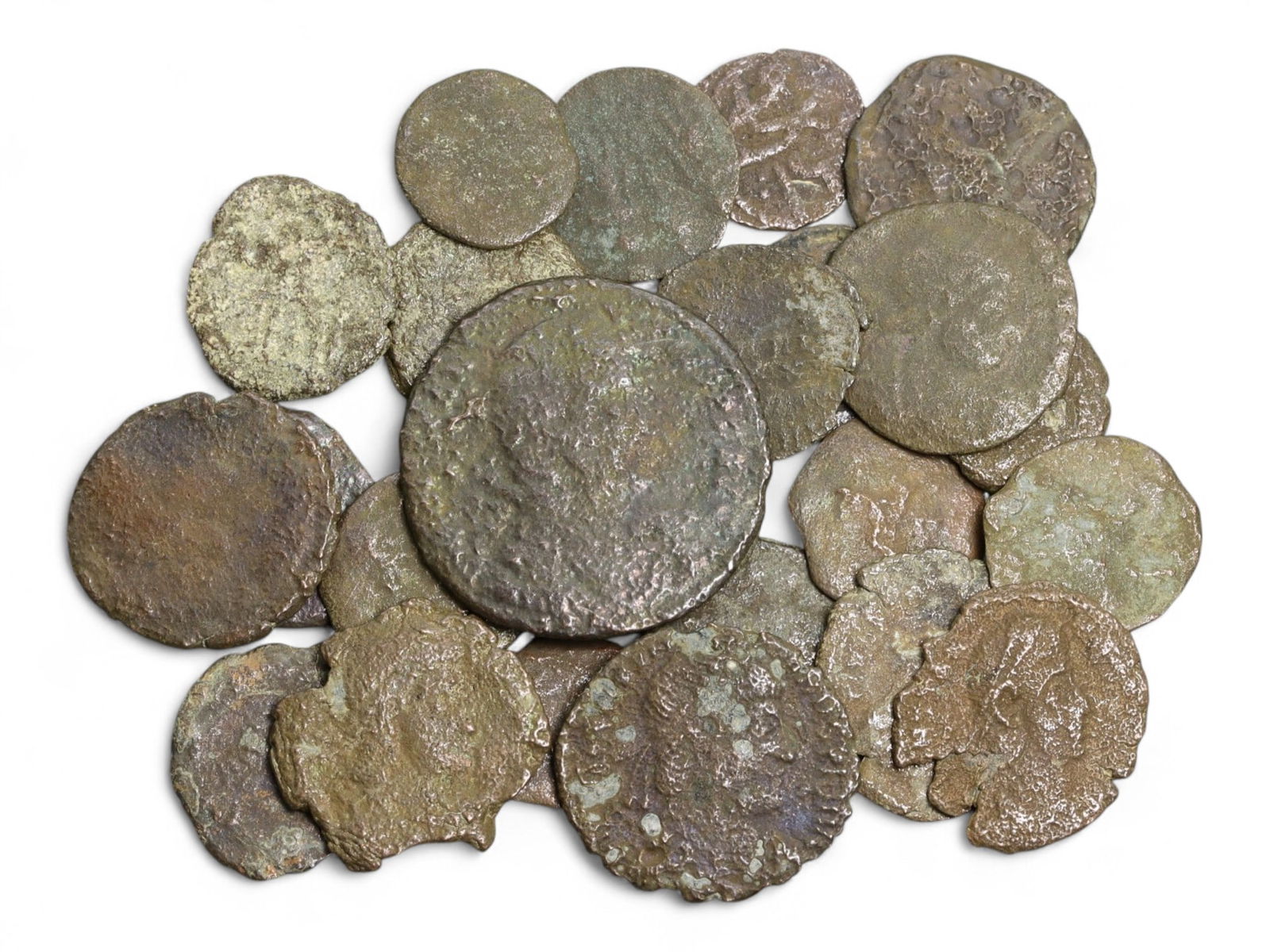 Ancient Roman Bronze Coins Lot, AE3 and AE4, c. 3rd-5th Century CE, 25 Coins: This lot of 25 bronze coins represents the currency of the late Roman Empire, spanning the 3rd to 5th centuries CE. These pieces, known as AE3 and AE4 denominations, were the small change of the Roman
