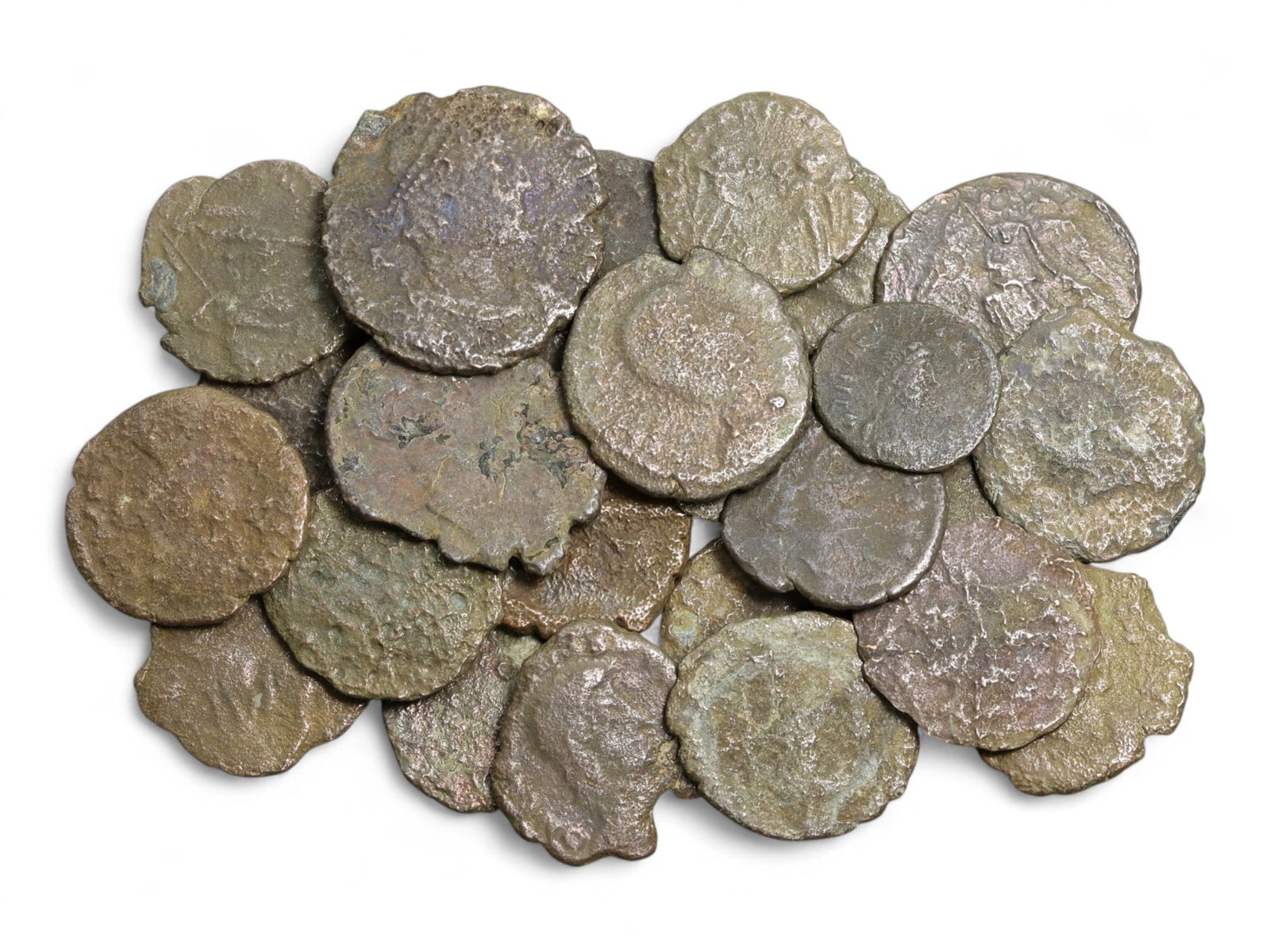 Ancient Roman Bronze Coins Lot, AE3 and AE4, c. 3rd-5th Century CE, 25 Coins: This lot of 25 bronze coins represents the currency of the late Roman Empire, spanning the 3rd to 5th centuries CE. These pieces, known as AE3 and AE4 denominations, were the small change of the Roman