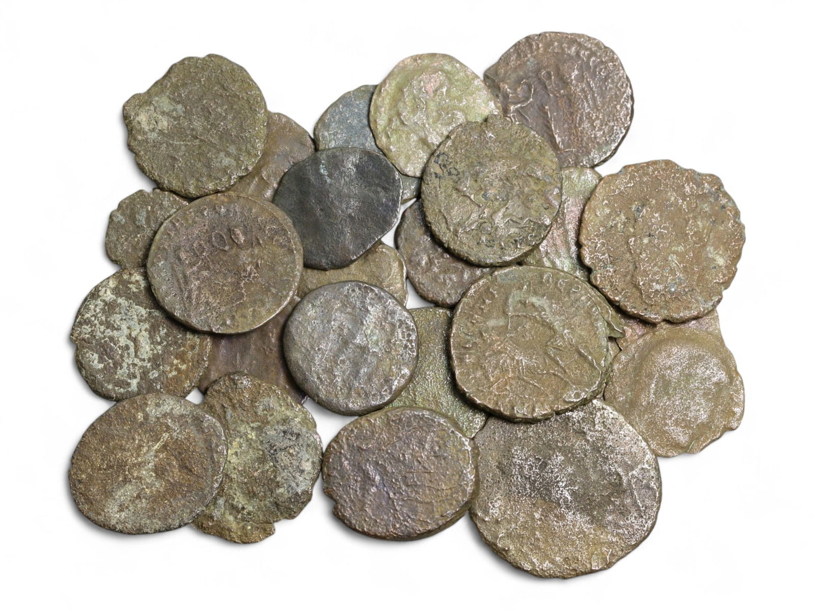 Ancient Roman Bronze Coins Lot, AE3 and AE4, c. 3rd-5th Century CE, 25 Coins: This lot of 25 bronze coins represents the currency of the late Roman Empire, spanning the 3rd to 5th centuries CE. These pieces, known as AE3 and AE4 denominations, were the small change of the Roman