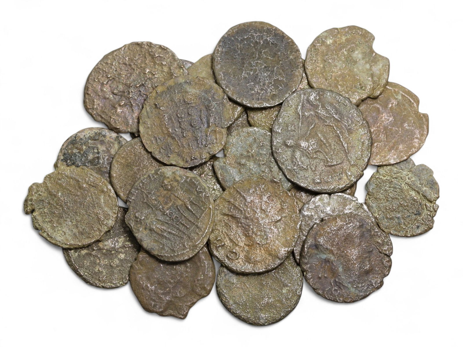 Ancient Roman Bronze Coins Lot, AE3 and AE4, c. 3rd-5th Century CE, 25 Coins: This lot of 25 bronze coins represents the currency of the late Roman Empire, spanning the 3rd to 5th centuries CE. These pieces, known as AE3 and AE4 denominations, were the small change of the Roman