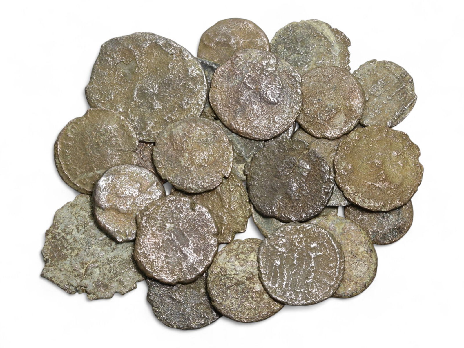 Ancient Roman Bronze Coins Lot, AE3 and AE4, c. 3rd-5th Century CE, 25 Coins: This lot of 25 bronze coins represents the currency of the late Roman Empire, spanning the 3rd to 5th centuries CE. These pieces, known as AE3 and AE4 denominations, were the small change of the Roman
