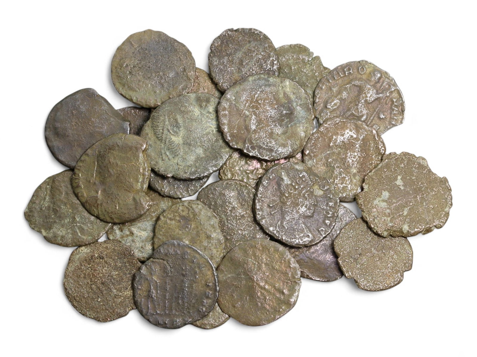 Ancient Roman Bronze Coins Lot, AE3 and AE4, c. 3rd-5th Century CE, 25 Coins: This lot of 25 bronze coins represents the currency of the late Roman Empire, spanning the 3rd to 5th centuries CE. These pieces, known as AE3 and AE4 denominations, were the small change of the Roman