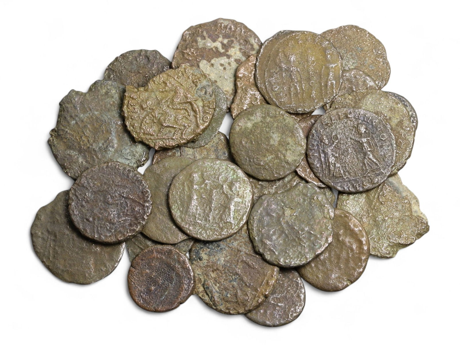 Ancient Roman Bronze Coins Lot, AE3 and AE4, c. 3rd-5th Century CE, 25 Coins: This lot of 25 bronze coins represents the currency of the late Roman Empire, spanning the 3rd to 5th centuries CE. These pieces, known as AE3 and AE4 denominations, were the small change of the Roman