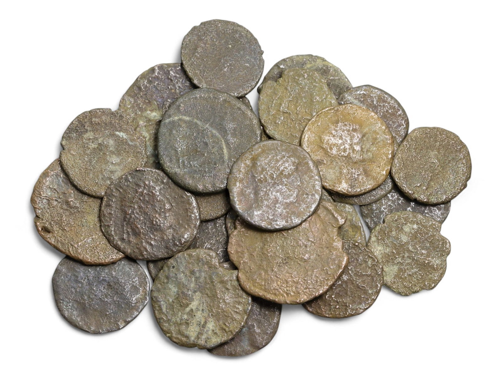 Ancient Roman Bronze Coins Lot, AE3 and AE4, c. 3rd-5th Century CE, 25 Coins: This lot of 25 bronze coins represents the currency of the late Roman Empire, spanning the 3rd to 5th centuries CE. These pieces, known as AE3 and AE4 denominations, were the small change of the Roman