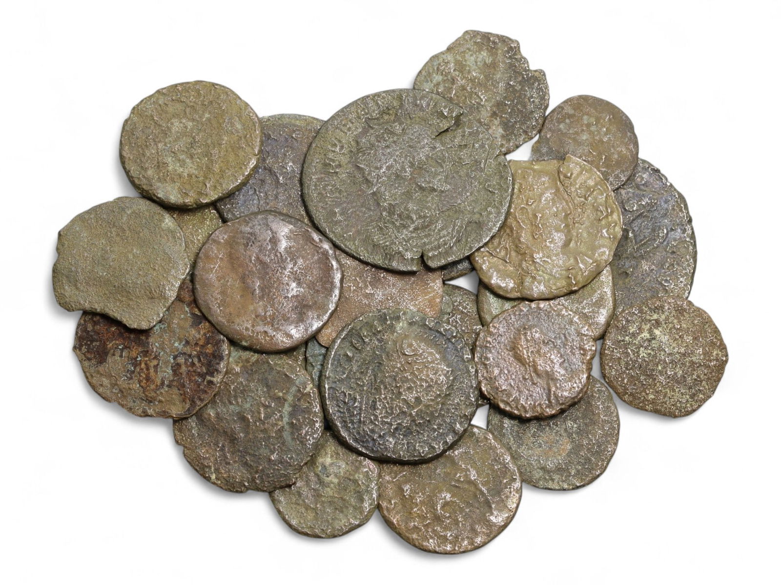 Ancient Roman Bronze Coins Lot, AE3 and AE4, c. 3rd-5th Century CE, 25 Coins: This lot of 25 bronze coins represents the currency of the late Roman Empire, spanning the 3rd to 5th centuries CE. These pieces, known as AE3 and AE4 denominations, were the small change of the Roman