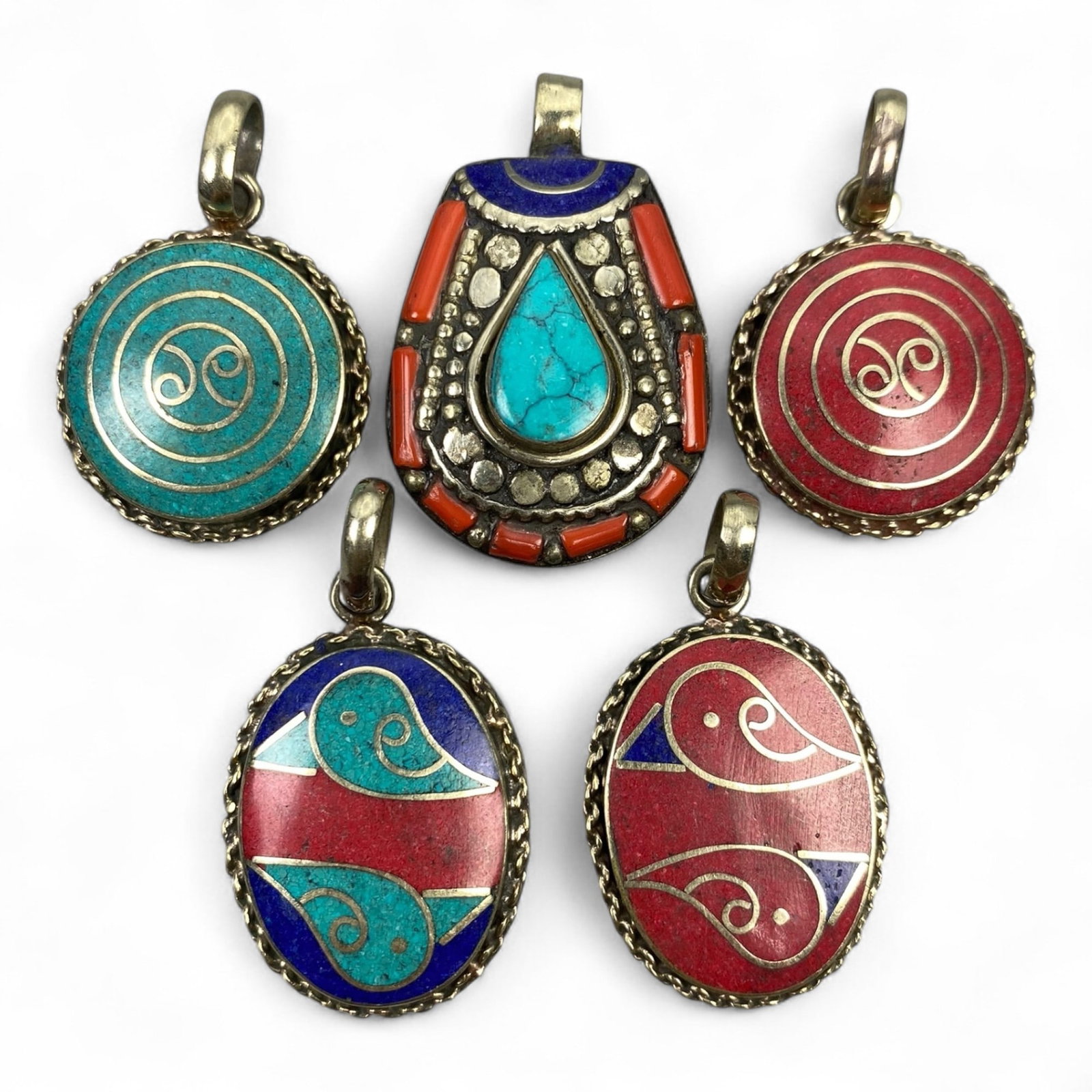 Vintage Himalayan Tribal Pendants, Lot of 5, c. 20th Century, 3-4 cm: These vintage Himalayan pendants capture the spirit and artistry of traditional jewelry from the highlands of Tibet and Nepal. Crafted with vibrant inlay work and detailed metal framing, they exemplif