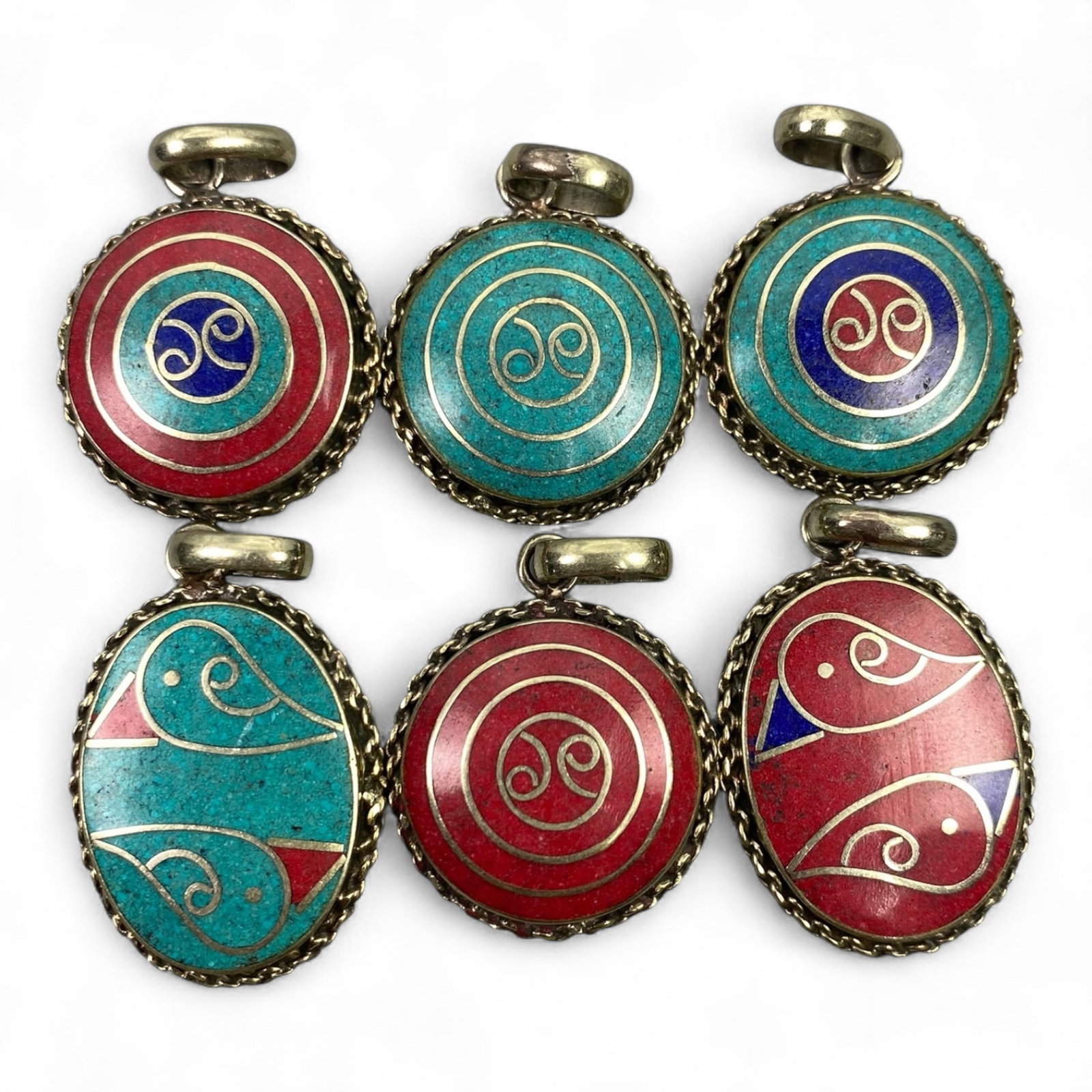 Vintage Himalayan Tribal Pendants, Lot of 6, c. 20th Century, 3-4 cm: These vintage Himalayan pendants capture the spirit and artistry of traditional jewelry from the highlands of Tibet and Nepal. Crafted with vibrant inlay work and detailed metal framing, they exemplif