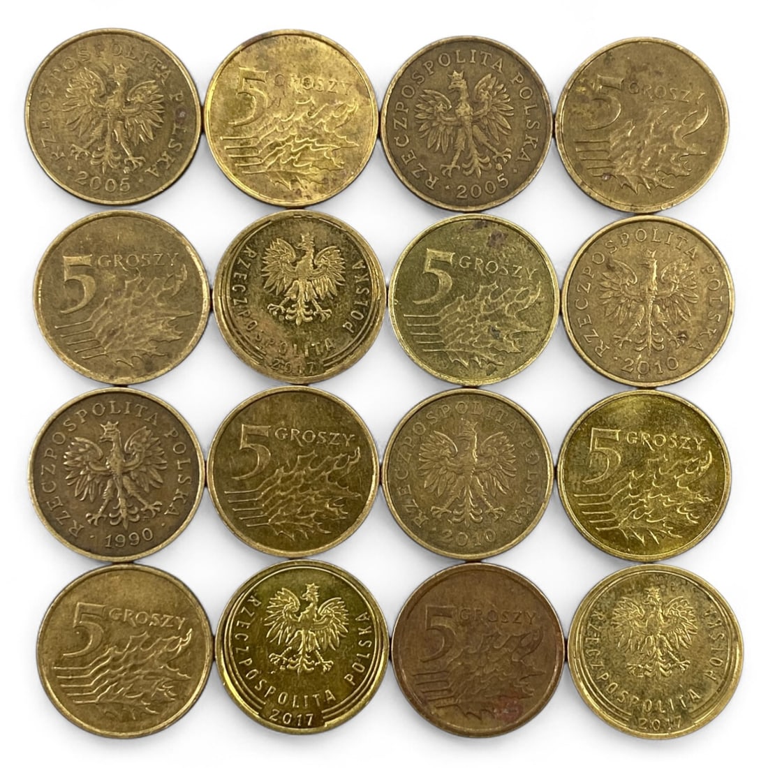 POLAND: Modern Eagle and Renewal Lot, 1990-2017: This unified lot of Polish 5 Groszy coins offers a striking view of national continuity and design evolution from the post-communist era into the 21st century. Each coin bears the bold crowned eagle-O