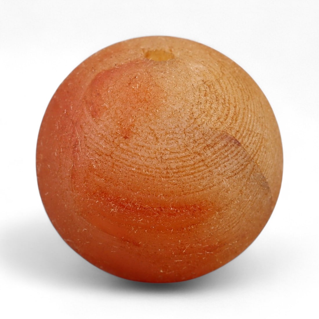 Antique Tibetan Carnelian Mala Prayer Bead, c. 18th-19th Century, 1.8cm: This antique carnelian mala bead originates from the Himalayan cultural sphere, most likely 18th-19th century Tibet, a period when devotional craftsmanship flourished under the influence of both Buddh