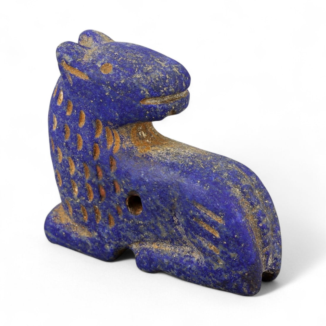 Ancient Bactrian Lapis Lazuli Lion Effigy, c. 2nd-1st Millennium BCE, L 4.5cm: This striking lapis lazuli effigy, carved in the form of a recumbent lion, originates from ancient Bactria, circa 2nd-1st millennium BCE. Sculpted from vibrant blue lapis lazuli streaked with veins of