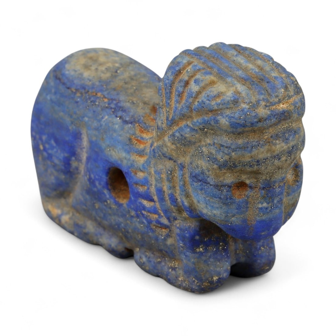 Ancient Bactrian Lapis Lazuli Lion Effigy, c. 2nd-1st Millennium BCE, L 5cm: This striking lapis lazuli effigy, carved in the form of a recumbent lion, originates from ancient Bactria, circa 2nd-1st millennium BCE. Sculpted from vibrant blue lapis lazuli streaked with veins of