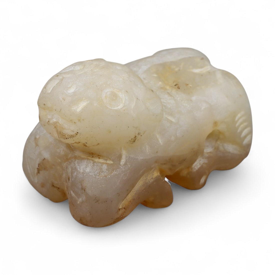 Ancient Bactrian Feline Amulet in Alabaster Stone, c. 2200-1800 BCE, 4 cm: This compact amulet, carved in the form of a crouching feline, originates from the ancient Bactrian region-modern northern Afghanistan and southern Central Asia-during the Bronze Age. Crafted from fin