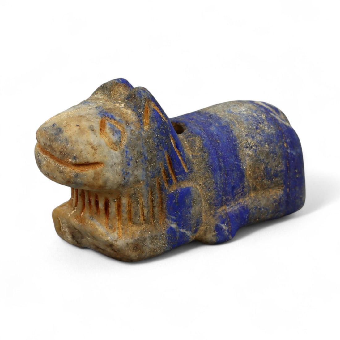 Ancient Bactrian Lapis Lazuli Lion Effigy, c. 2nd-1st Millennium BCE, 5cm: This striking lapis lazuli effigy, carved in the form of a recumbent lion, originates from ancient Bactria, circa 2nd-1st millennium BCE. Sculpted from vibrant blue lapis lazuli streaked with veins of