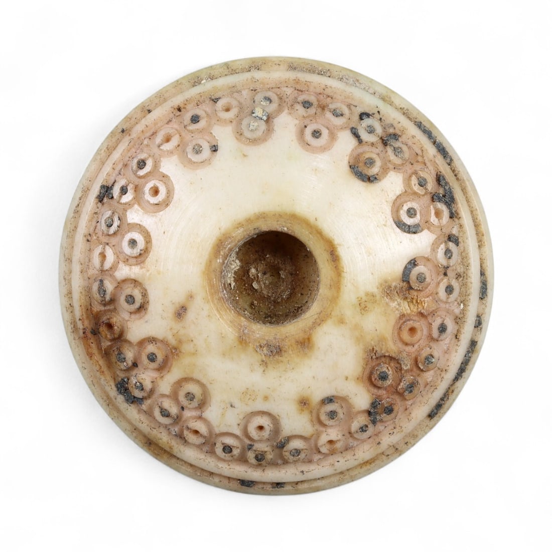Ancient Medieval Nishapur Silk Road Bone Spindle Whorl, c. 9th-11th Century CE, 2.7cm: This finely carved spindle whorl originates from Nishapur, an important Silk Road city in medieval northeastern Iran, dating to approximately the 9th-11th century CE. Such spindle whorls were essentia