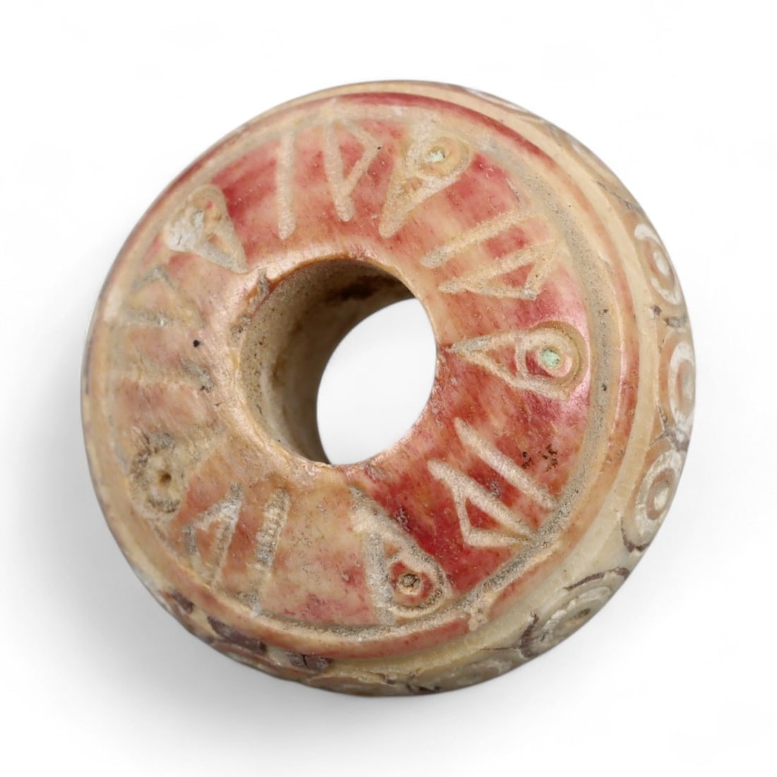 Ancient Medieval Nishapur Silk Road Bone Spindle Whorl, c. 9th-11th Century CE, 1.6cm: This finely carved spindle whorl originates from Nishapur, an important Silk Road city in medieval northeastern Iran, dating to approximately the 9th-11th century CE. Such spindle whorls were essentia